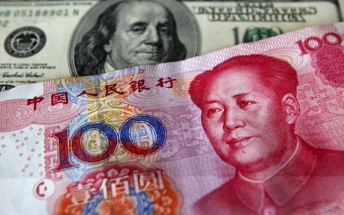 Le taux-pivot du yuan à son plus bas niveau depuis 4 ans face au dollar - ảnh 1